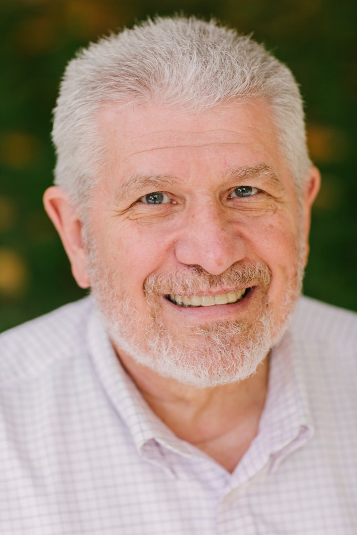 Dan Barton — white hair and beard, smiling